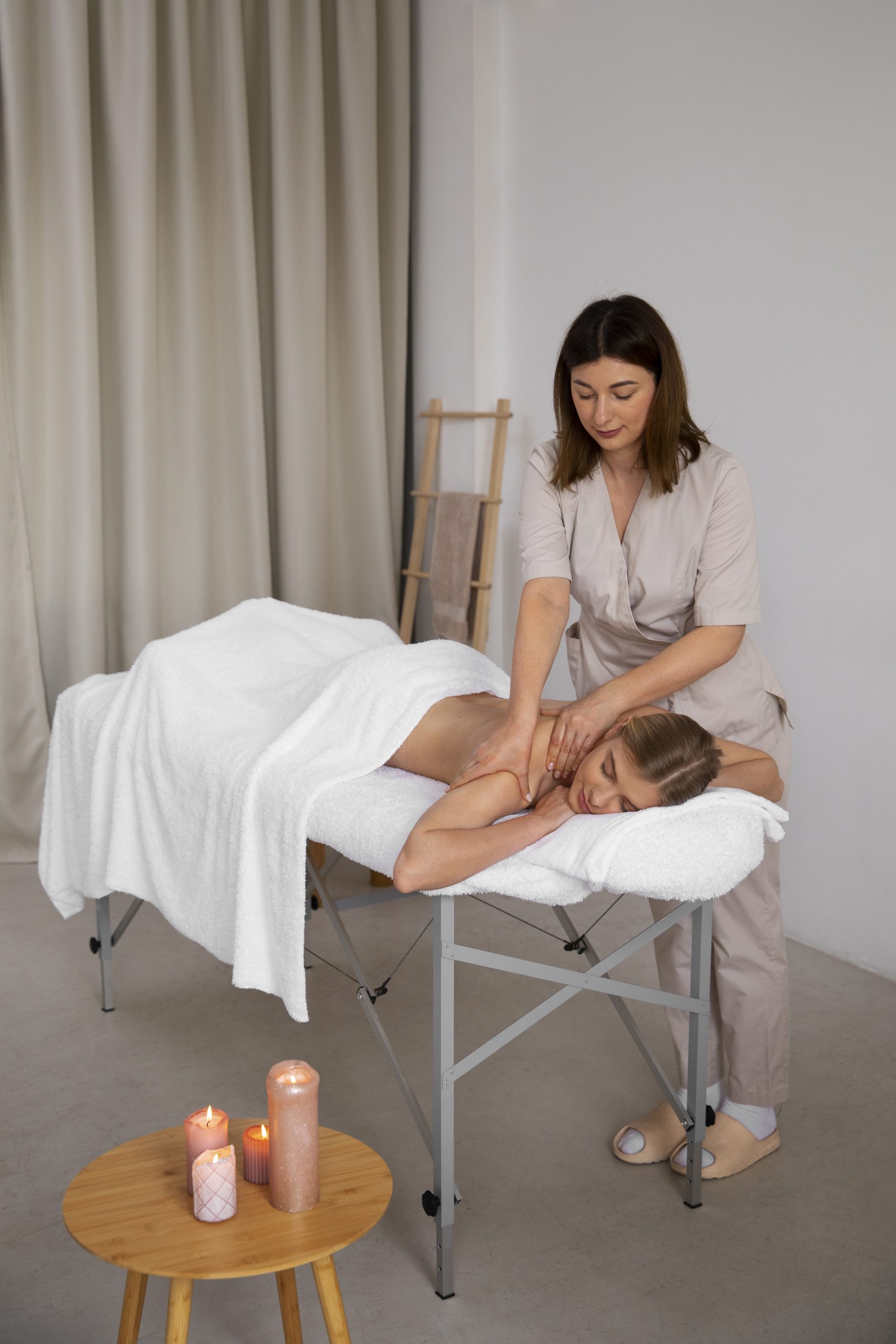 woman getting back massage from masseur